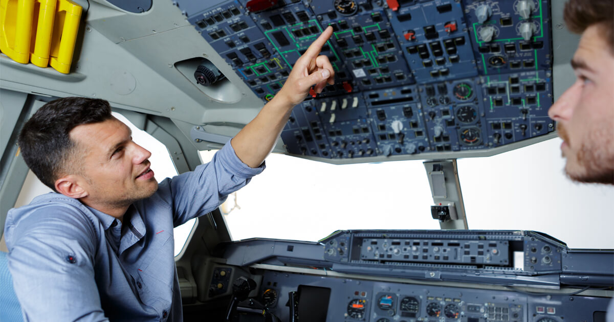 Airline pilot in the cockpit on final approach